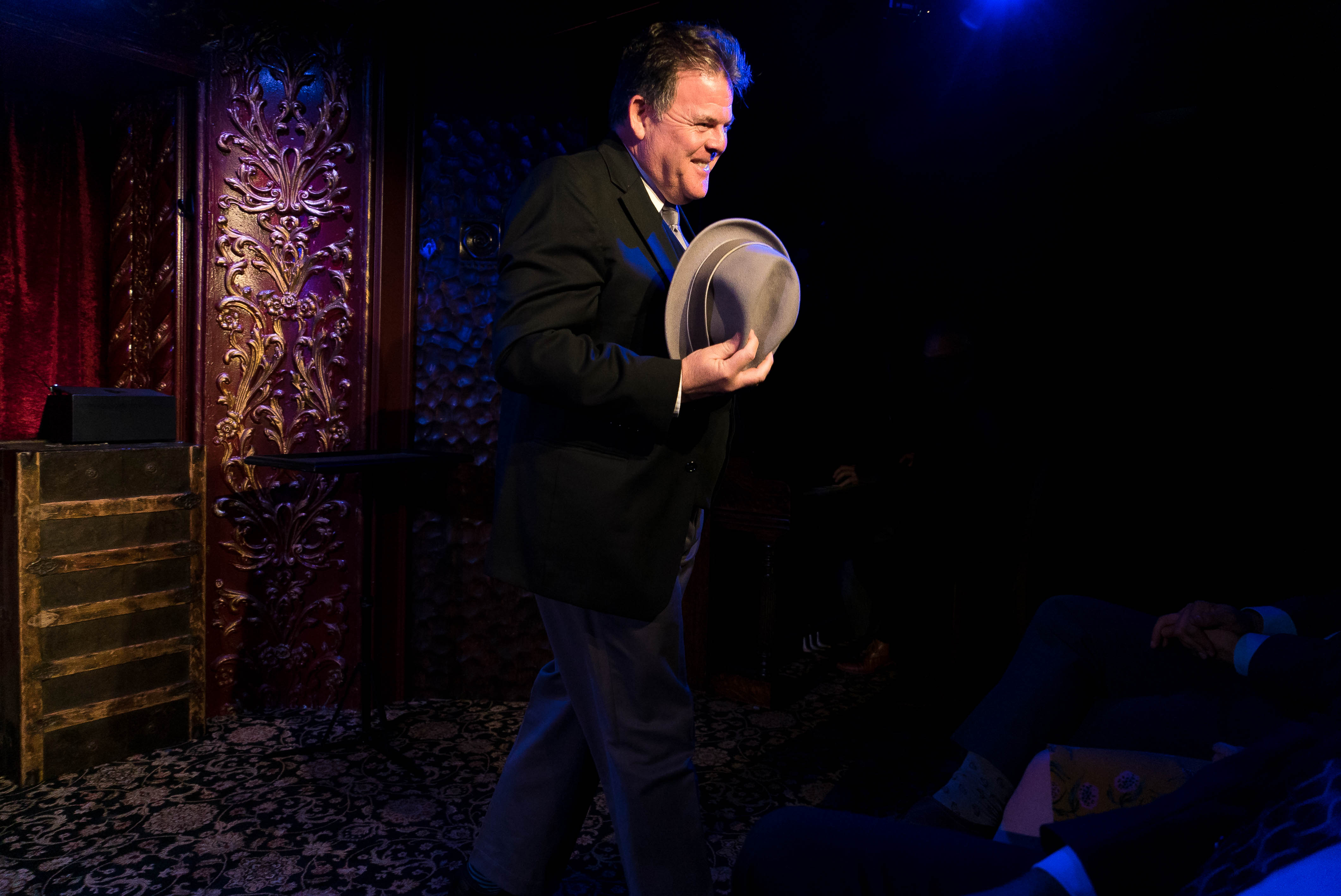 John Carney onstage with hat