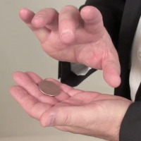 John demonstrating a coin transfer
